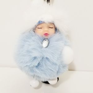 Baby Face Blue Pom Pom Keychain. New
